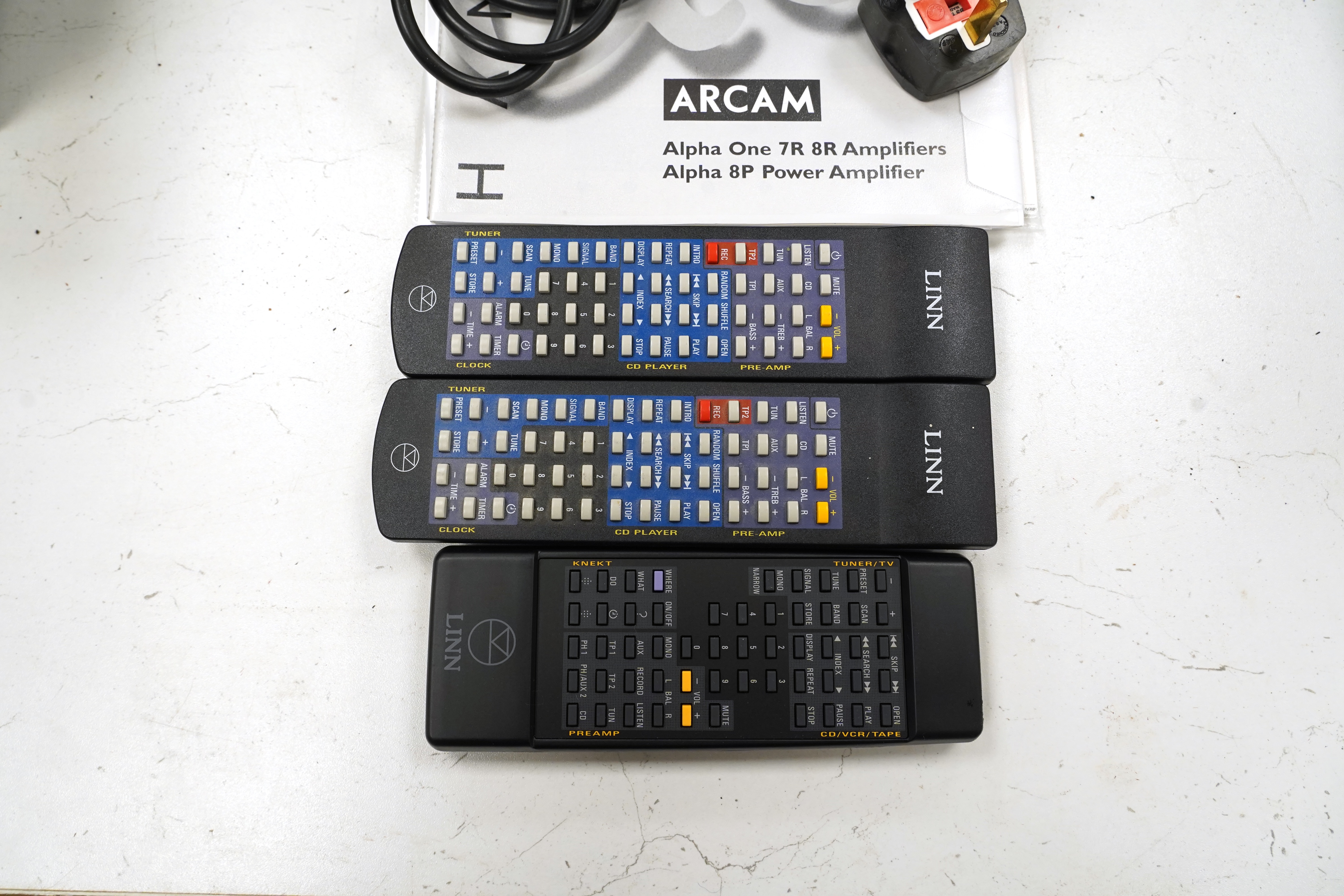 A Linn Pekin tuner, a Linn Genki CD player and three Arcam Alpha 8 Power Amps, with three remote controls, two power cables and instructions for the amplifiers